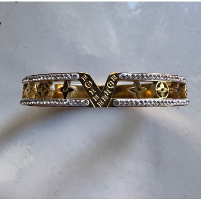 Ατσάλινη χειροπέδα με σχέδιο "v" σε χρυσό χρώμα 