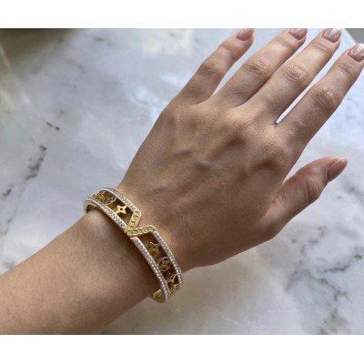 Ατσάλινη χειροπέδα με σχέδιο "v" σε χρυσό χρώμα 