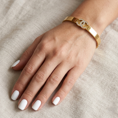 Βραχιόλι χειροπέδα CC από ανοξείδωτο ατσάλι σε χρυσό χρώμα