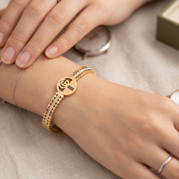 Ατσάλινη χρυσή χειροπέδα με ιδιαίτερο σχέδιο και στρας