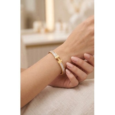 Ατσάλινη χειροπέδα "Η" σε χρυσό με στρας