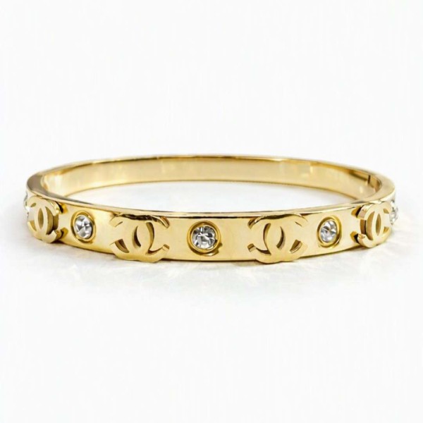 Χρυσό Bangle βραχιόλι με λαμπερά κρύσταλλα & εμβληματικά μοτίβα